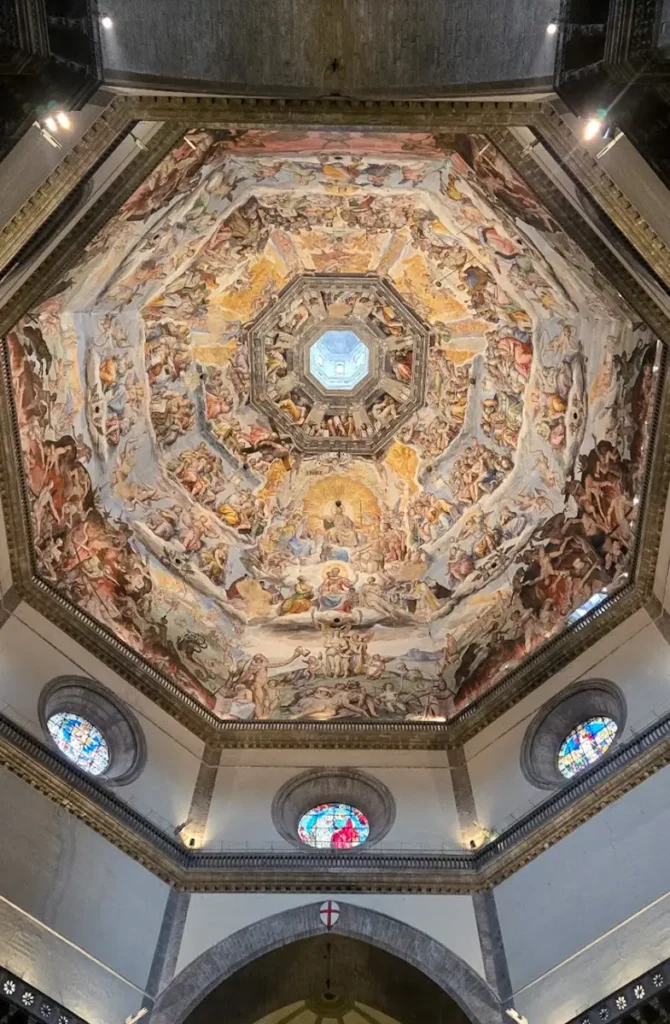 Detailed interior of Brunelleschi’s Dome inside Florence Cathedral duomo showing paintings, a must see landmark during a 3 days in Florence itinerary.