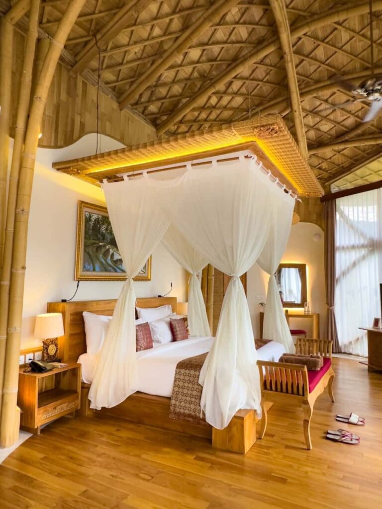 Inside the Royal Duplex Pool Villa at The Udaya Hotel & Spa in Ubud, Bali with warm wooden details, high ceilings, and a cosy Bali feel.
