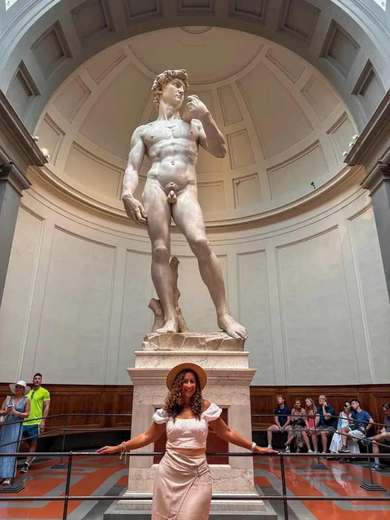 statue of Michael angelo inside historic museum in Florence Italy with arched ceiling a must see when in florence