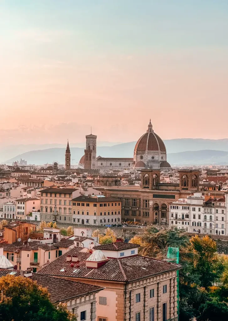 Florence 3 Days Itinerary: A Perfect Guide For First Timers A panoramic view of Florence with terracotta rooftops stretching toward the Duomo under soft golden light
